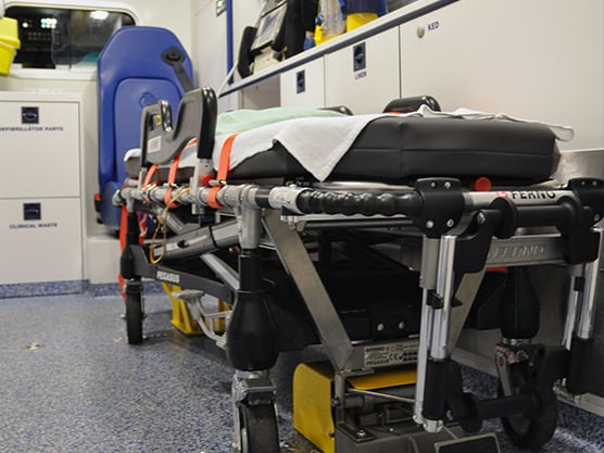 Patient stretcher and clinical equipment inside a specialist road ambulance